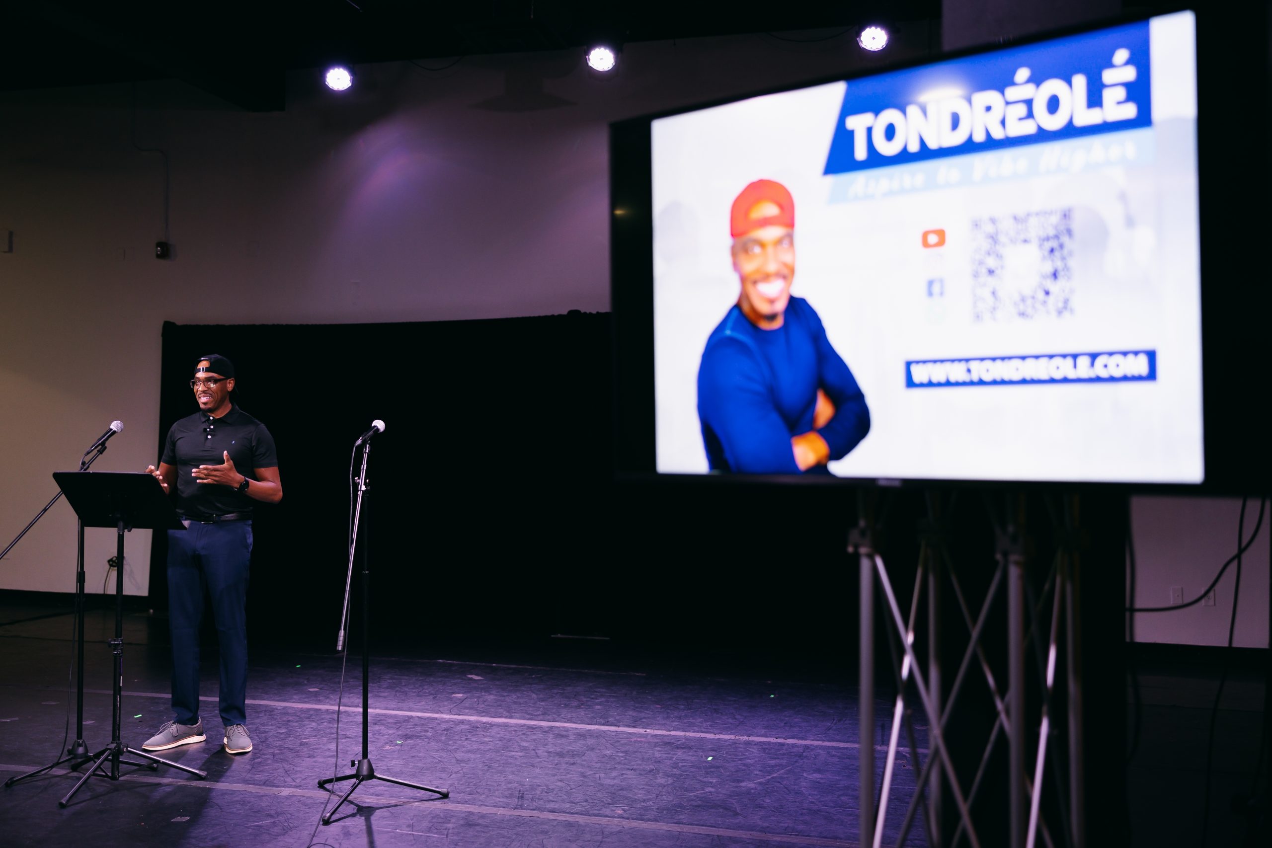 Tondré Olé speaking at an event